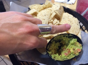 Finger added for scale. Also, fuck you for charging me $13 for a thimble full of shitty guac. 